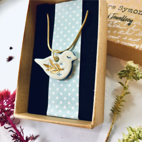 Porcelain and 22ct gold bird pendant
