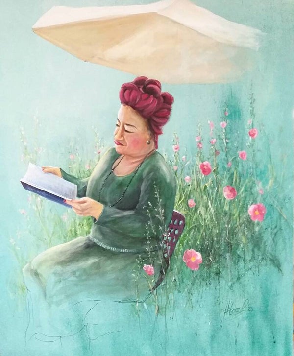 lesende Frau im Garten