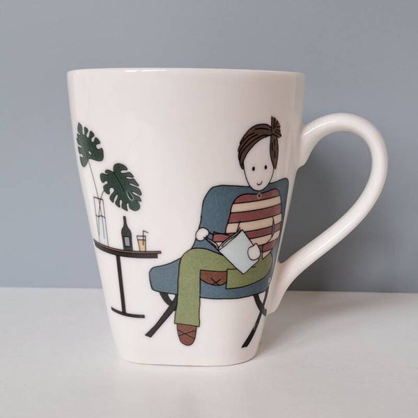 kneusje - Mok - man aan het lezen