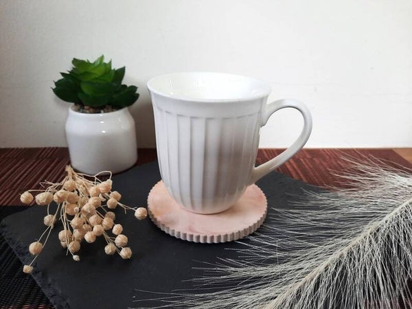 Onderzetters van Aquacast in de kleuren oker / terracotta met parelmoer afwerking(set 2 stuks)