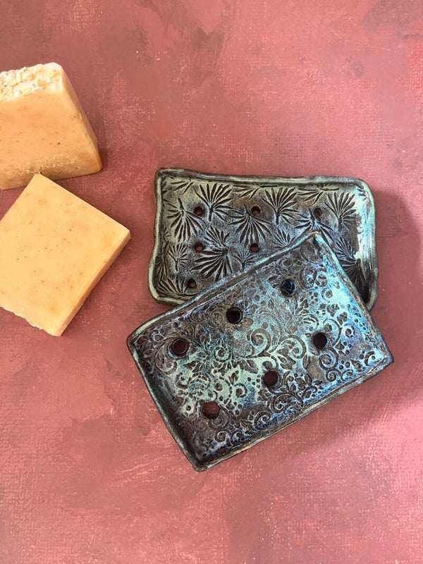 Hand made ceramic soap dish with ornaments.