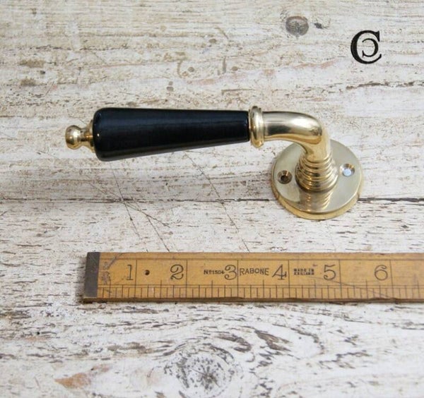 Lever Handle on Round Rose Ebony Ceramic and Brass