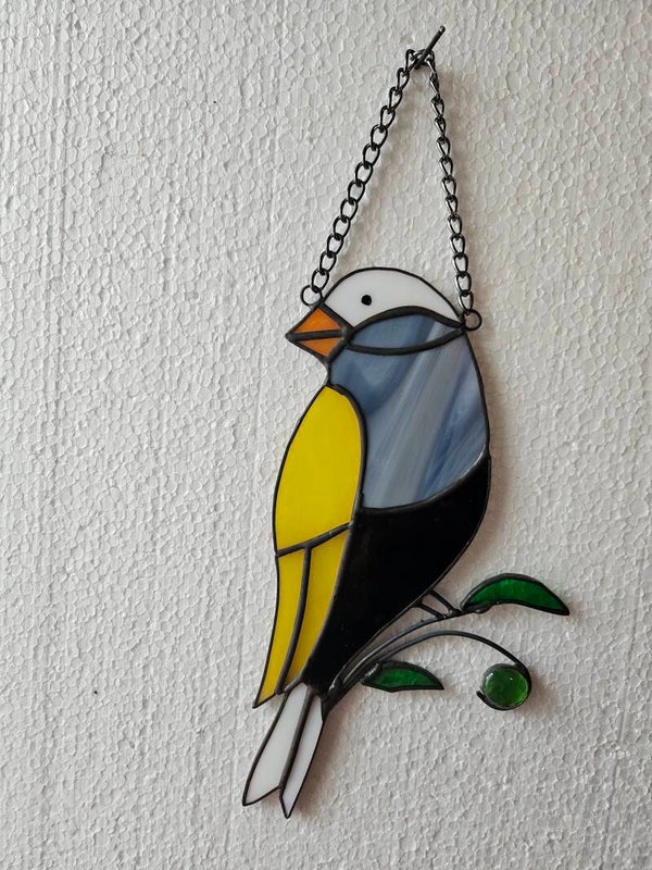 Vogel, meerkleurig, op takje
