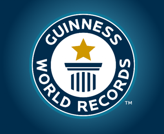 Logo ufficiale Guinness World Records con colonna stilizzata e stella dorata al centro su sfondo blu.