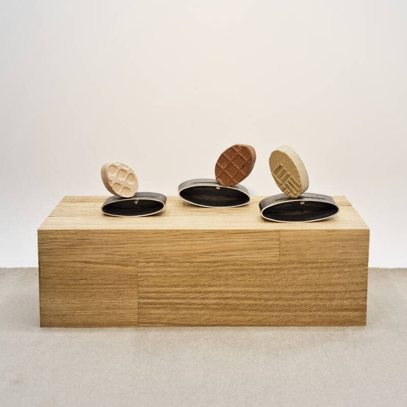 object with three brooches out of recycled materials