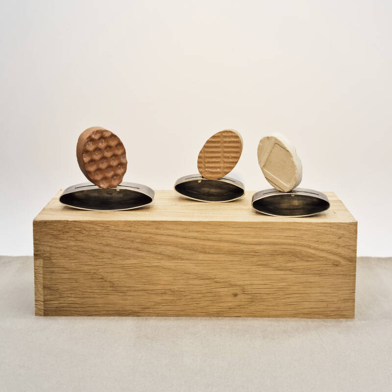 object with three brooches out of recycled tiles