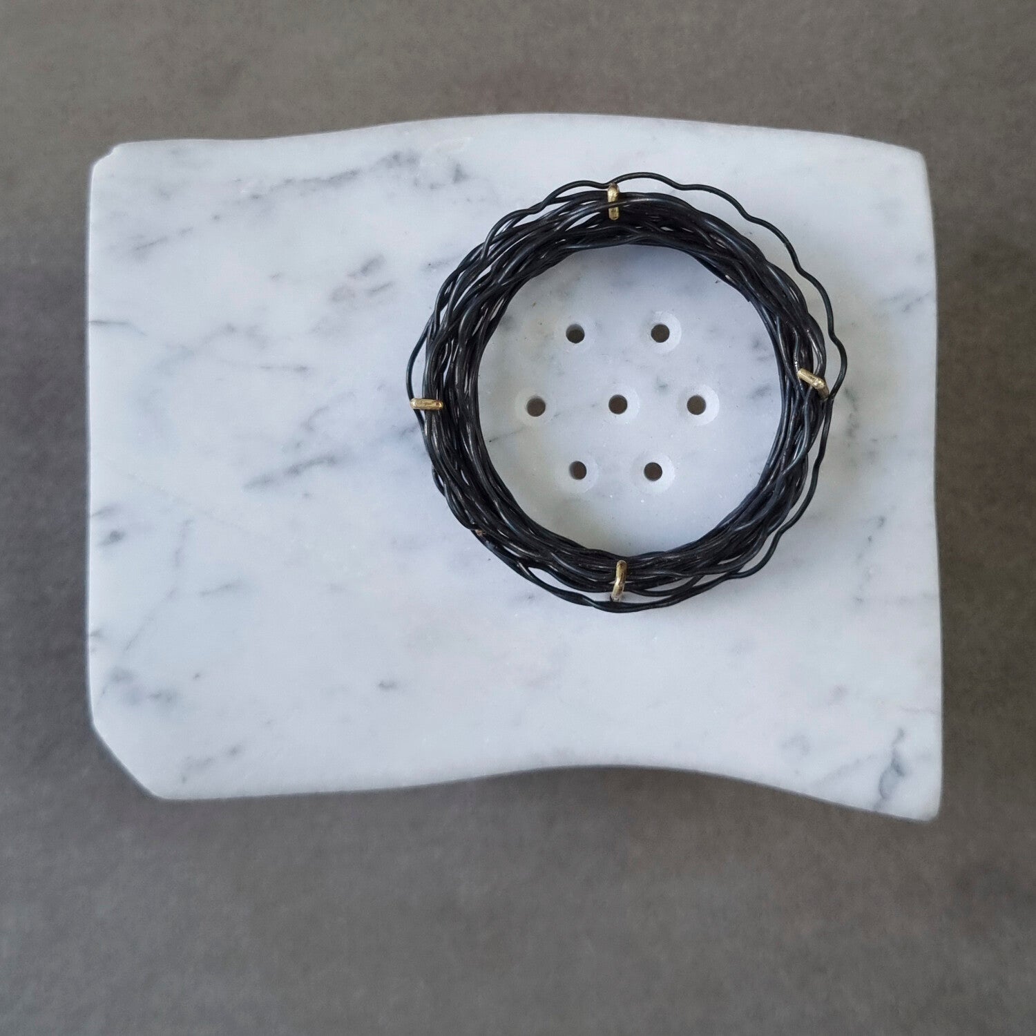 This brooch, 'Windows to the Soul', made of found marble, brass and iron wire, is my translation of an excerpt of The Epilogue of the Lyric Poet by Mihály Babits, in which I see transforming emotions and thoughts into art as a universal act. 
