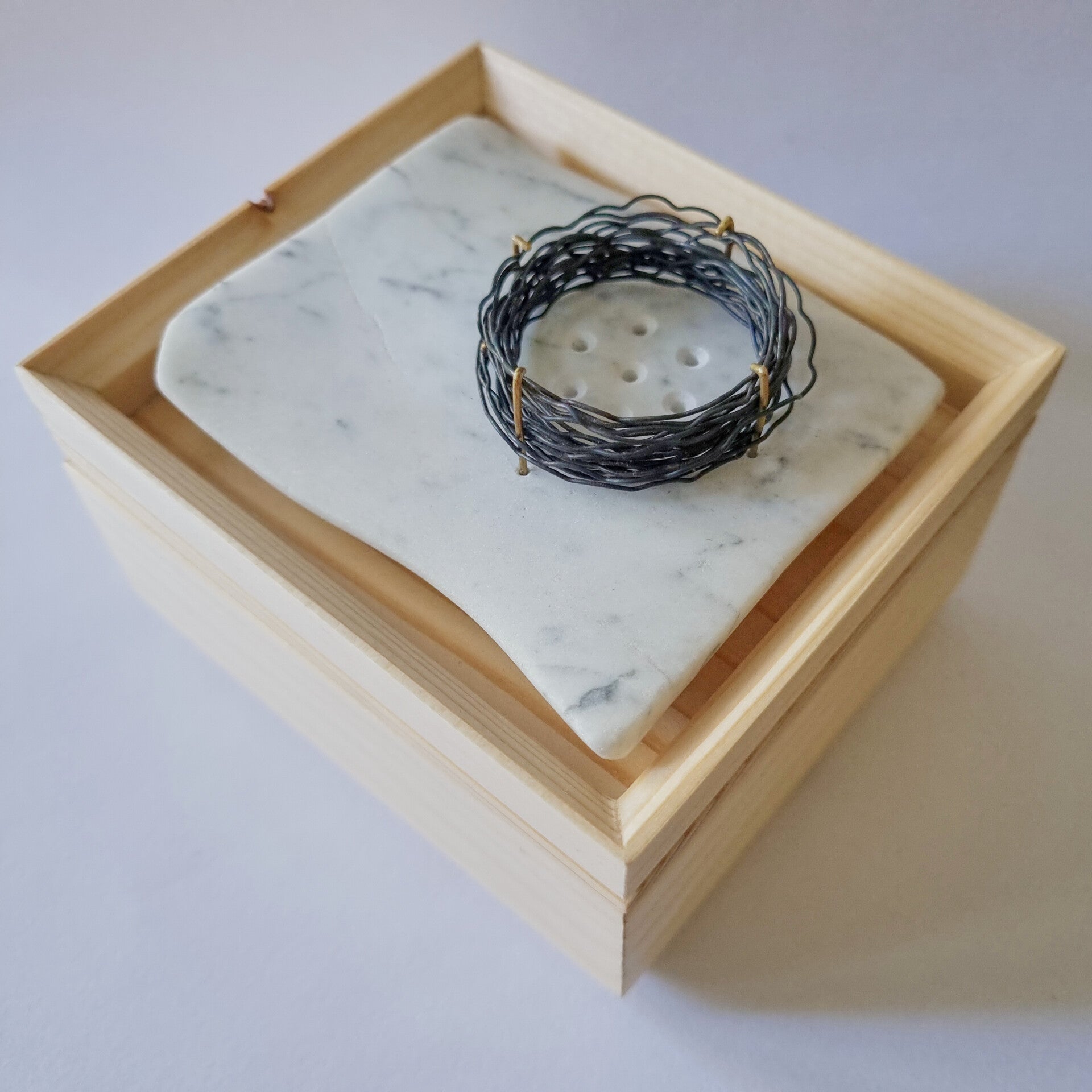 brooch, 'Windows to the Soul', presented on it's  box. The brooch is my translation of an excerpt of The Epilogue of the Lyric Poet by Mihály Babits, in which I see transforming emotions and thoughts into art as a universal act. 