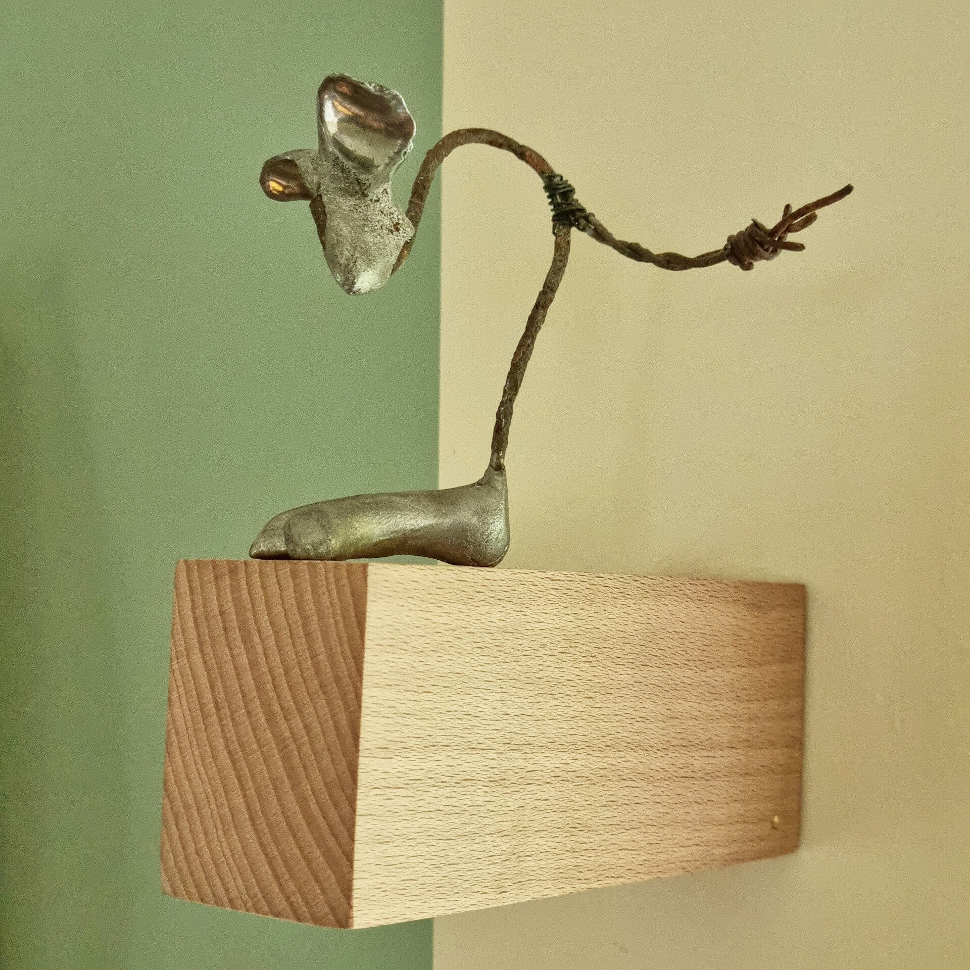 sculpture of a mouse made of recycled materials