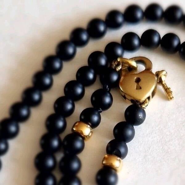 The Onyx gold locked heart and key