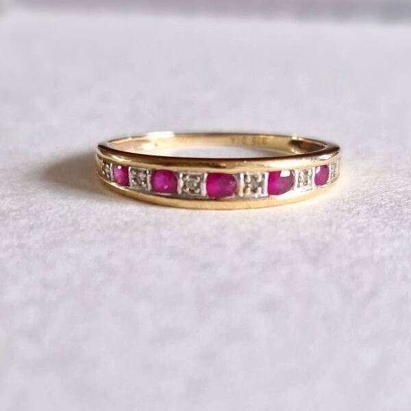 The ruby and diamond half eternity ring