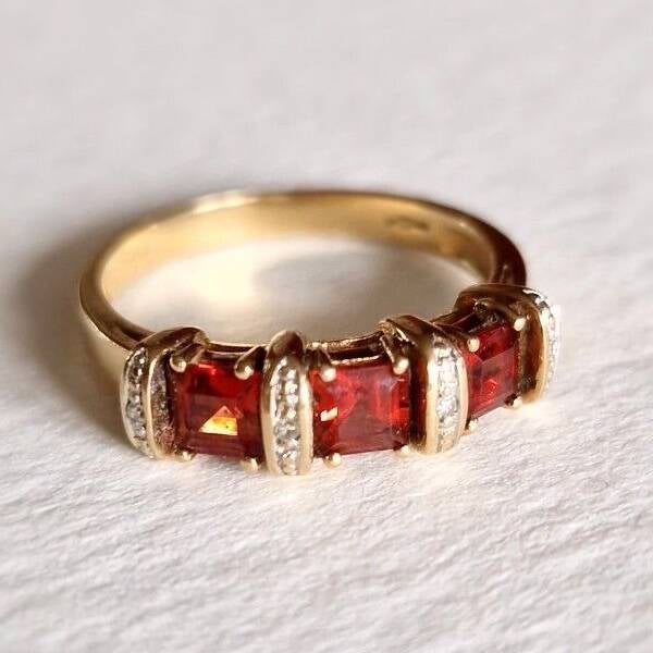 The orange Garnet and Diamonds triple row ring