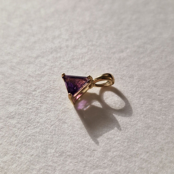 The Amethyst triangle pendant, with a sneaky letter A backside