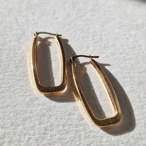 The gold earrings, modern but vintage