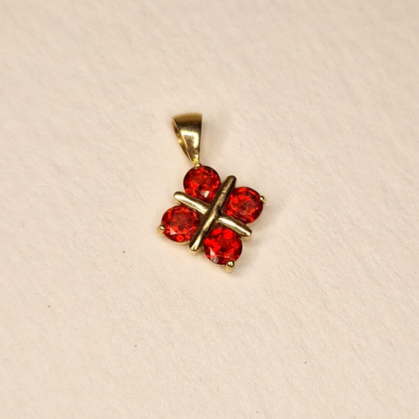 The golden garnet X pendant