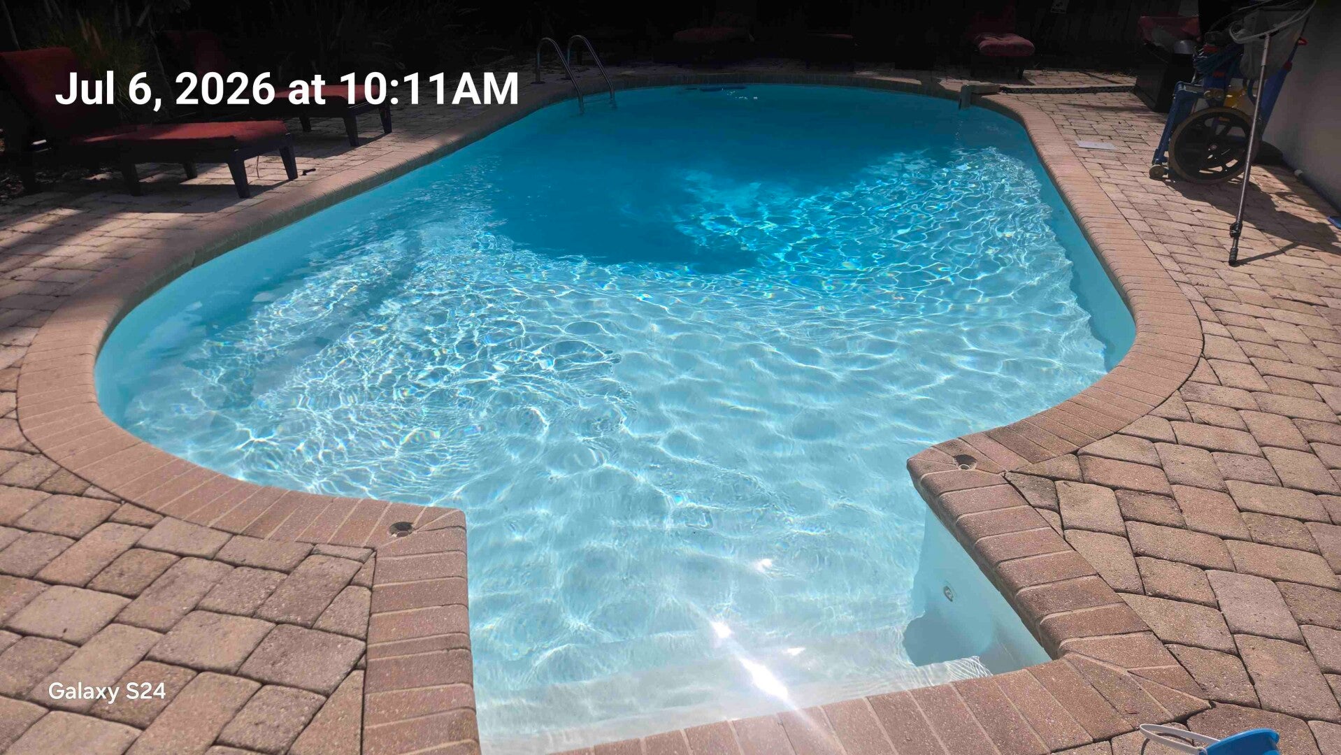Clear blue pool cleaned by Aqua Glimmer Pool Services in Clearwater, FL