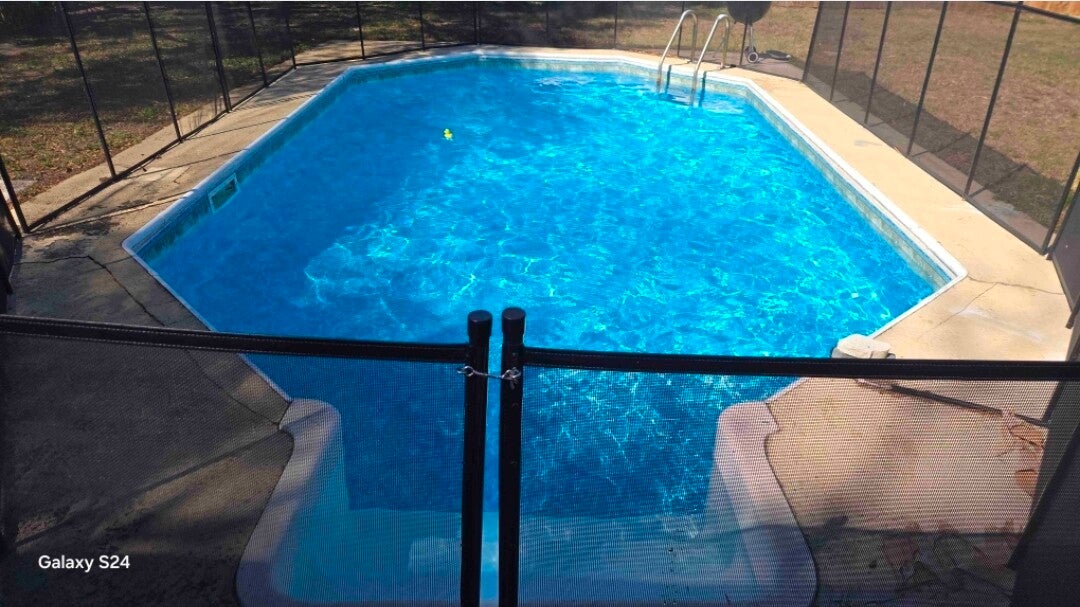 Clear blue pool after green-to-clean service by Aqua Glimmer Pool Services in Largo, FL