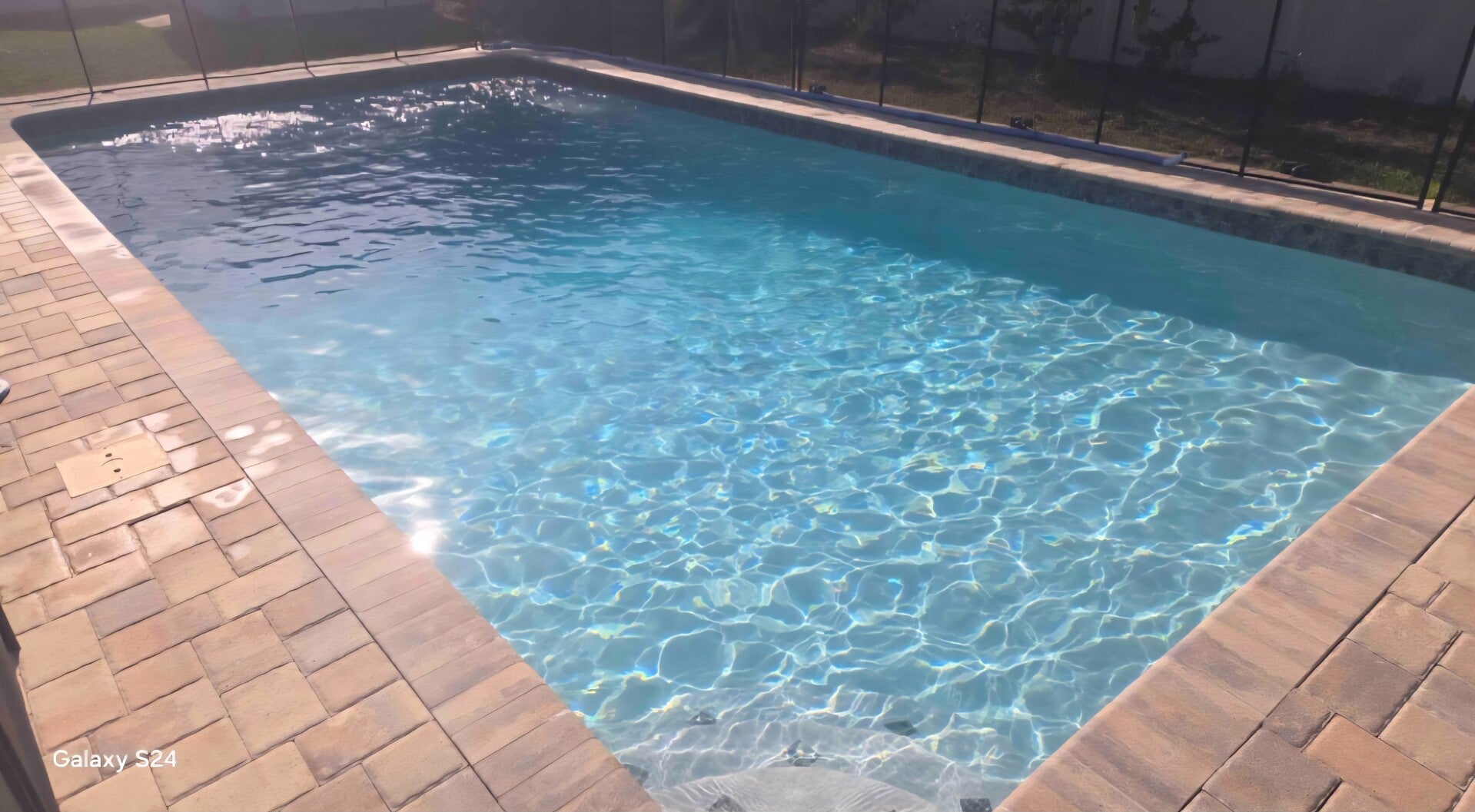 Clear blue pool cleaned by Aqua Glimmer Pool Services in Largo, FL