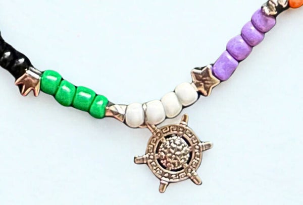 Hypoallergenic Silver-plated black, white , Orange , black and purple beaded necklace with a Helm  charm