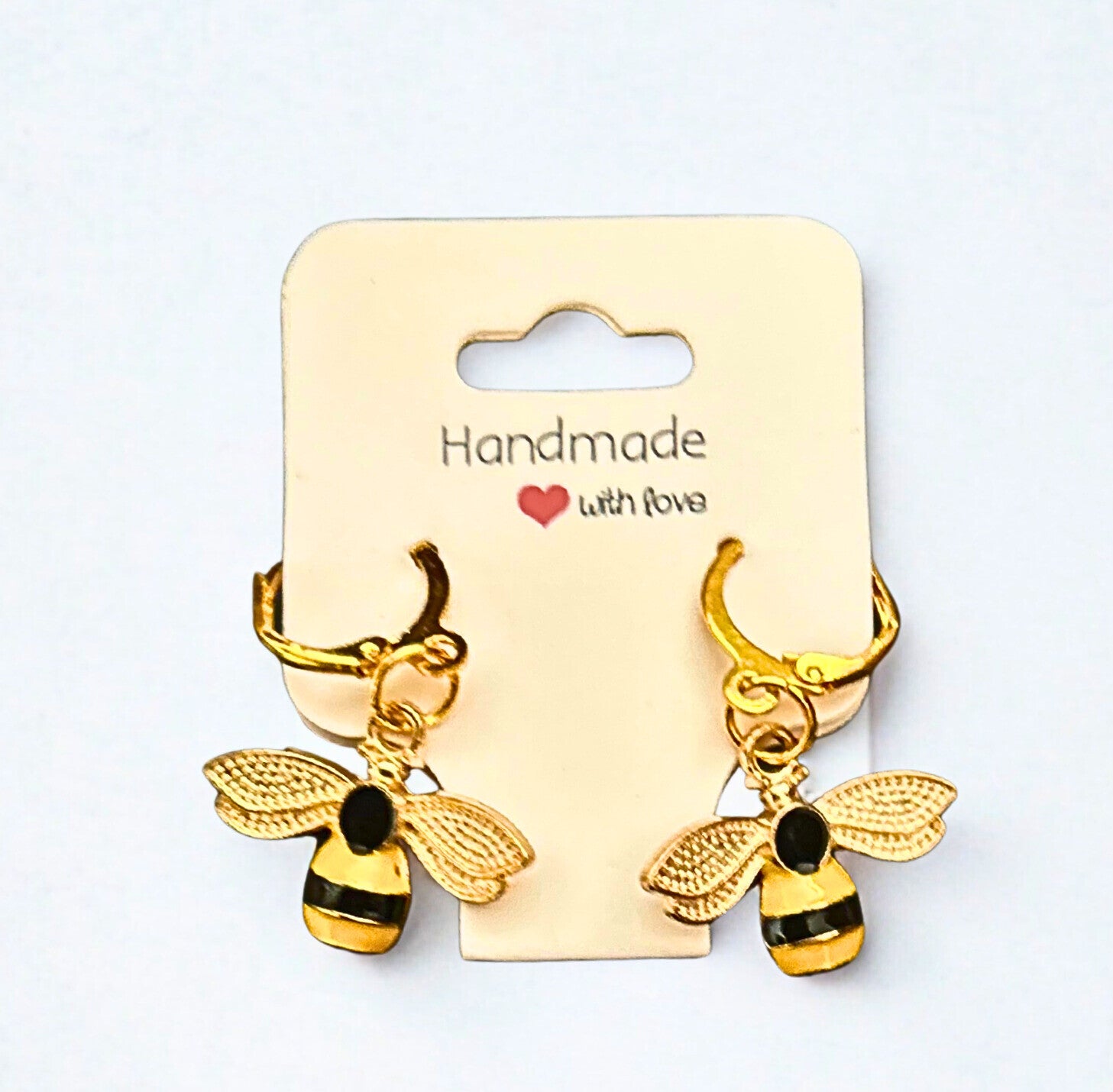 Gold-plated hoops with bumble bee charms