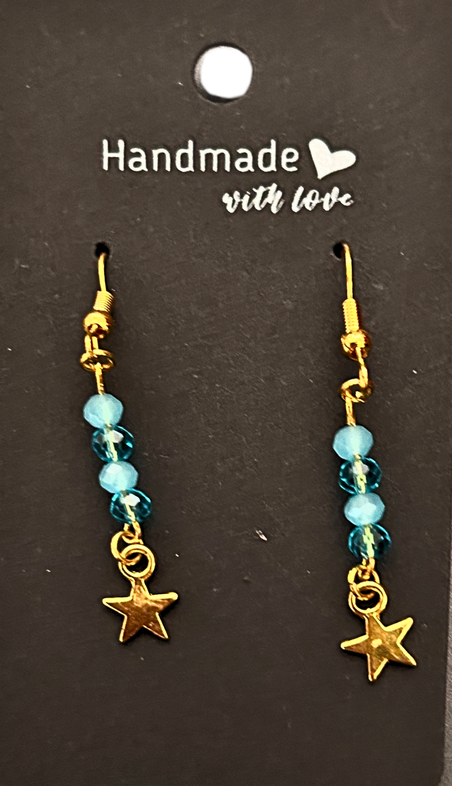 Gold-plated blue beaded earrings with gold star charms