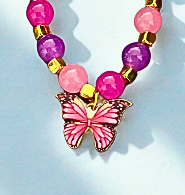 Hypoallergenic Gold -plated multi-coloured beaded bracelet with a pink butterfly charm