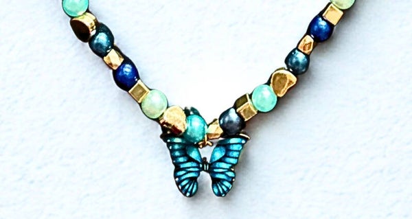 Hypoallergenic Gold-plated multi- blue beaded necklace with a turquoise blue butterfly charm