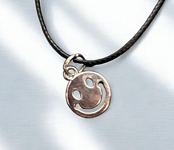 Hypoallergenic Silver - plated black rope bracelet with a Emily face charm