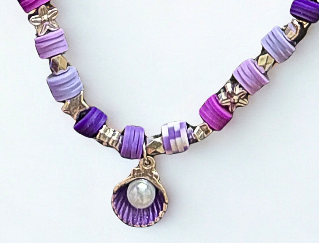 Hypoallergenic Gold -plated multi-purple beaded necklace with a purple shell and white pearl charm