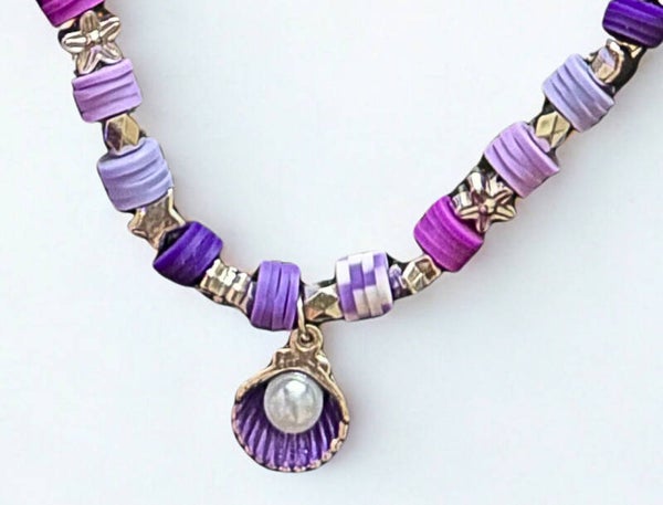 Hypoallergenic Gold -plated multi-purple beaded necklace with a purple shell and white pearl charm