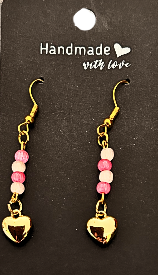 Gold-plated pink and white beaded earrings with a 18K gold heart charms