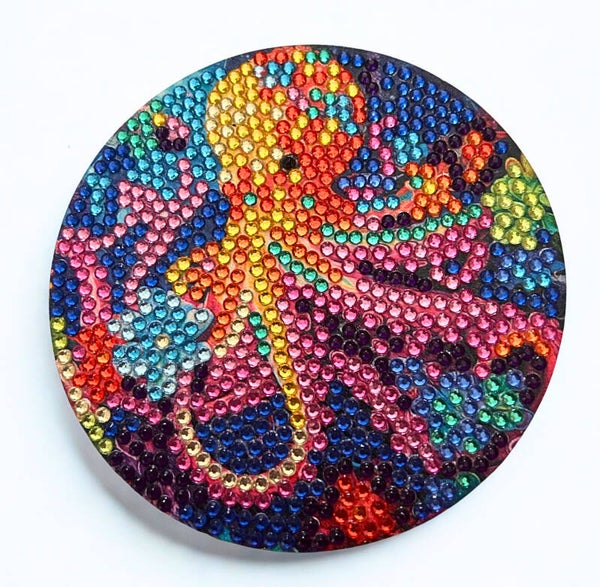 Diamond-painted set of 4 coasters with vibrant sea creatures including a octopus, starfish, otter and a jellyfish