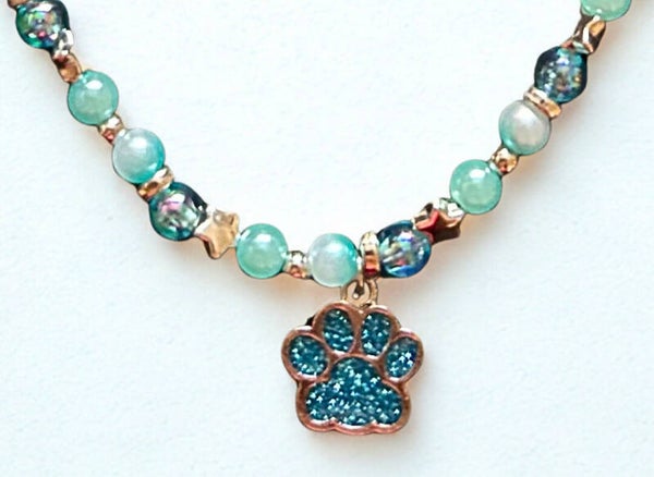 Hypoallergenic Silver-plated blue glittered paw necklace