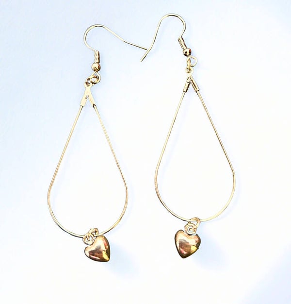 Silver-plated oval  hoop earrings with silver heart charms