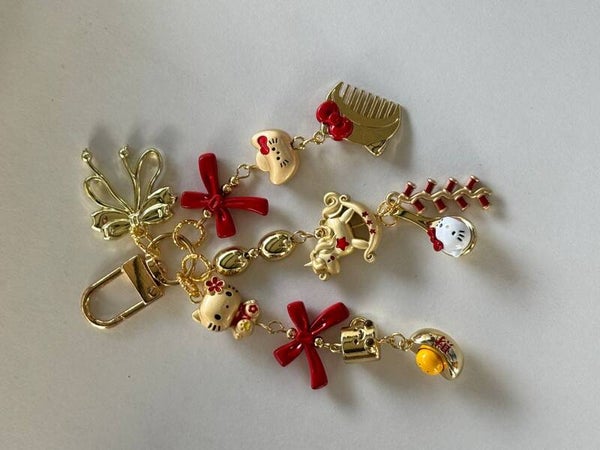Kitty Gold & Red Multi Charm Keychain with Bow, Comb & Rocking Horse