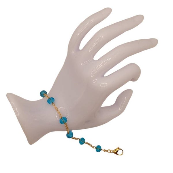 Schakelarmband goudkleurig met turquoise glaskralen