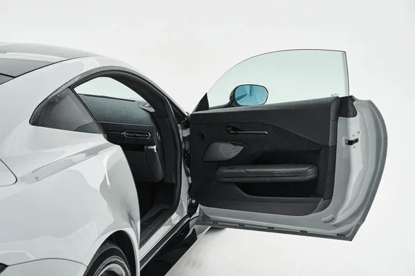 car passenger window  smashed with glass everywhere.