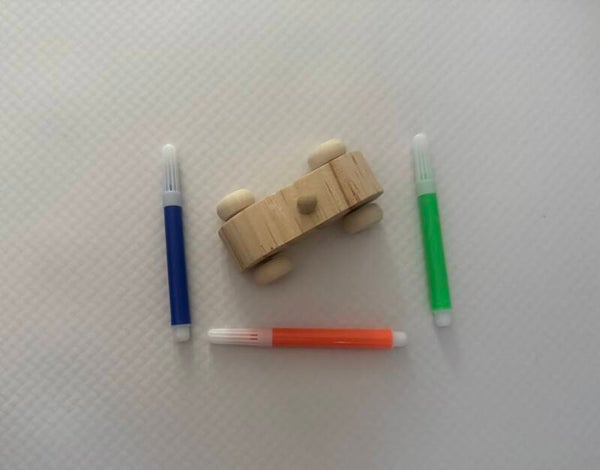 Small wooden car with moving wheels