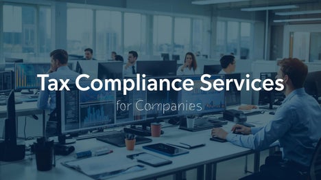 Modern office with accountants analysing tax compliance data on screen, charts and reports spread out, overlaid text ‘Tax Compliance Services for Companies’