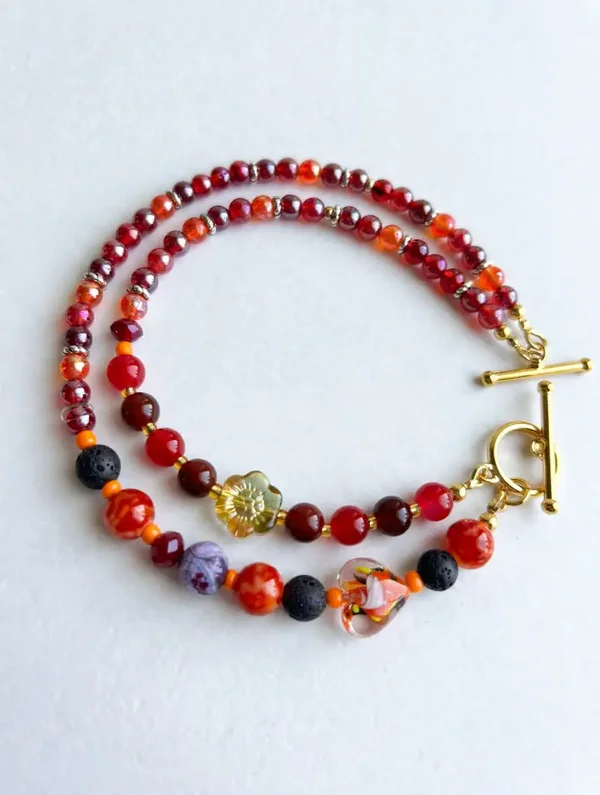 Triple-strand lava rock and glass bead bracelet