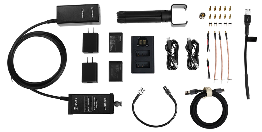 Everything supplied with the Siglent ODP6050B laid out: probe head, receiver, attenuators, tips, batteries, charger, adaptors, cables and support bracket