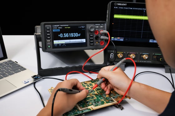 Siglent SDM4000A multimeter in use on the bench