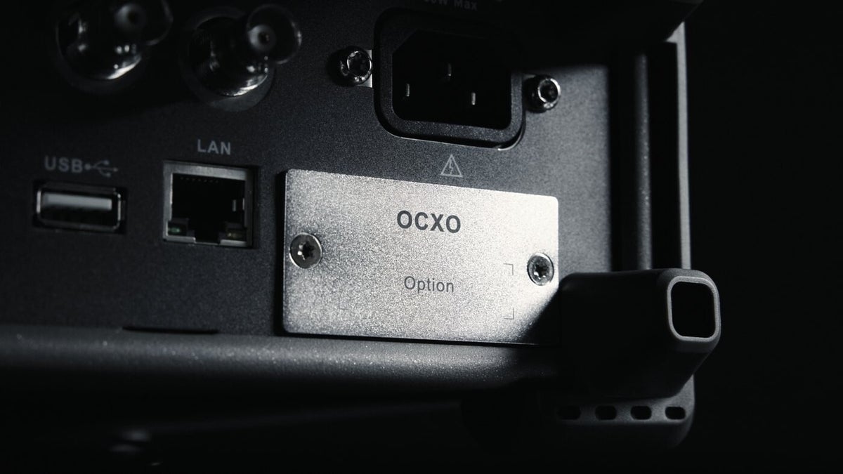 Rear panel of the SSG3000X Plus showing the OCXO option bay beside the USB and LAN ports