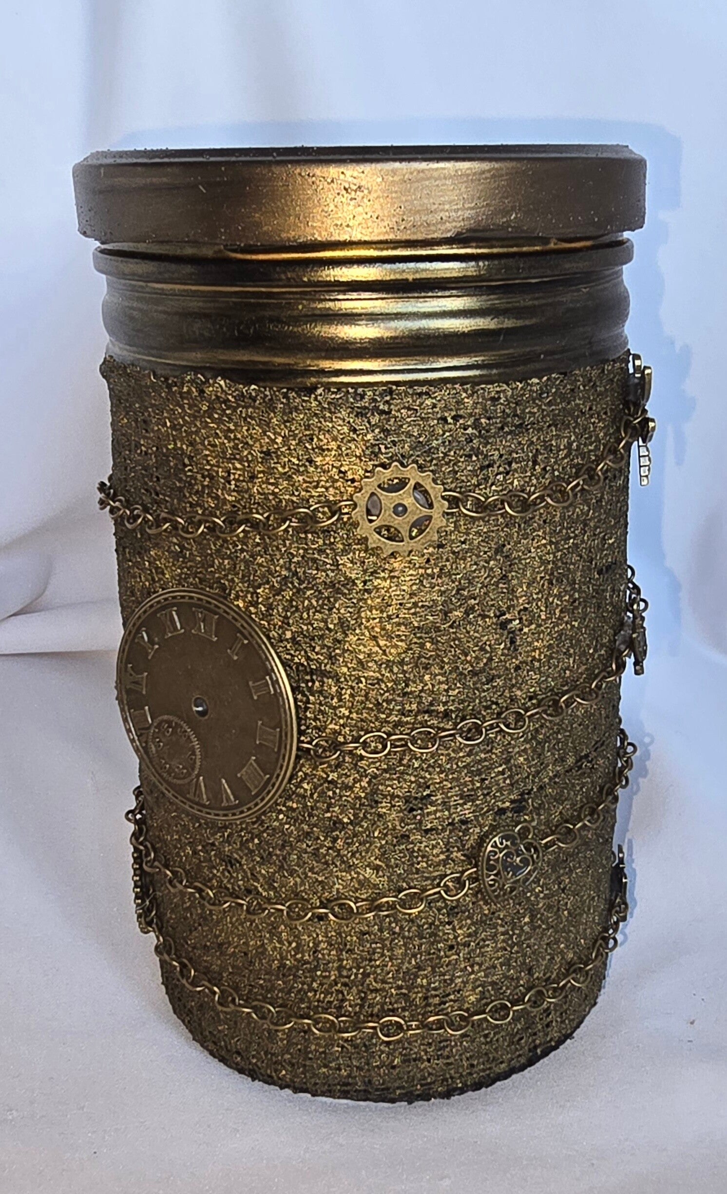 Schraubglas bandagiert mit bronzefarbenem Kettchen