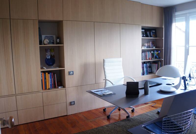 Modern home office with wooden shelves