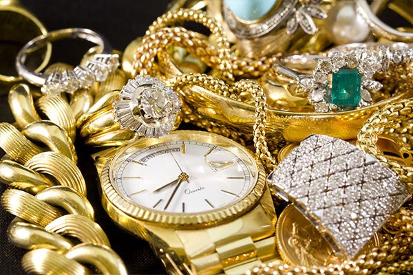 gold jewelry with a gold watch