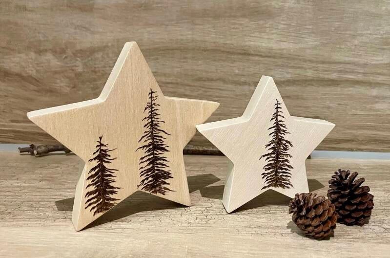 Deko-Weihnachtssterne mit Tannen