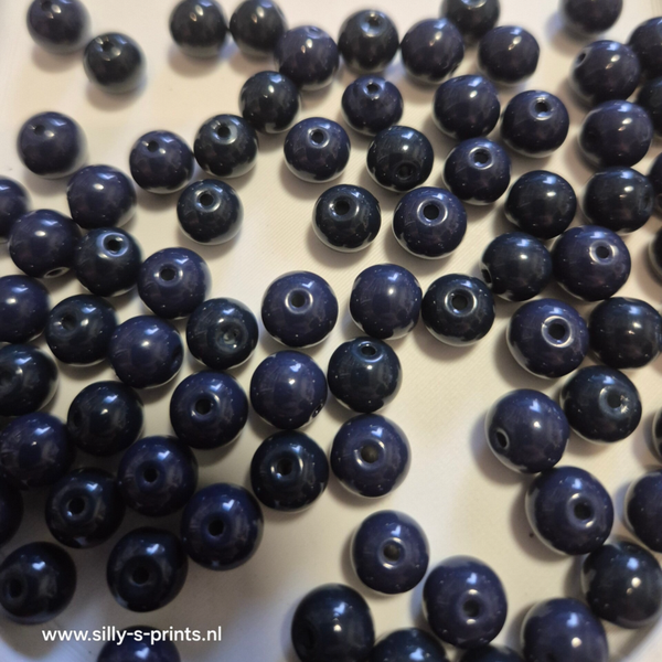 glas kraal rond donker blauw