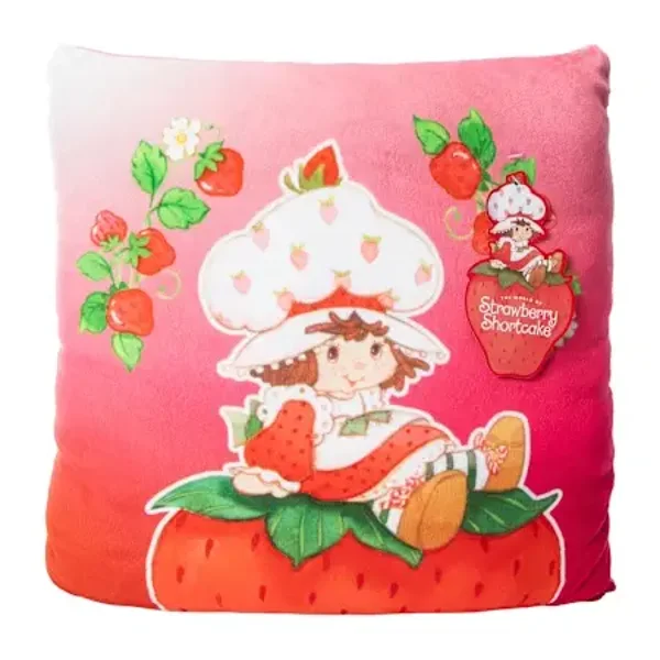 Strawberry Shortcake™ - Sitting on a Strawberry throw pillow