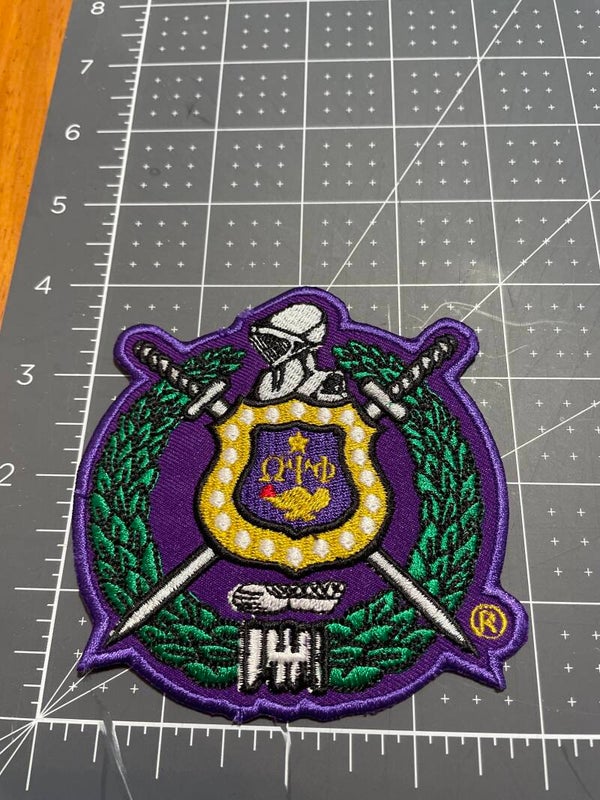 Omega crest patch